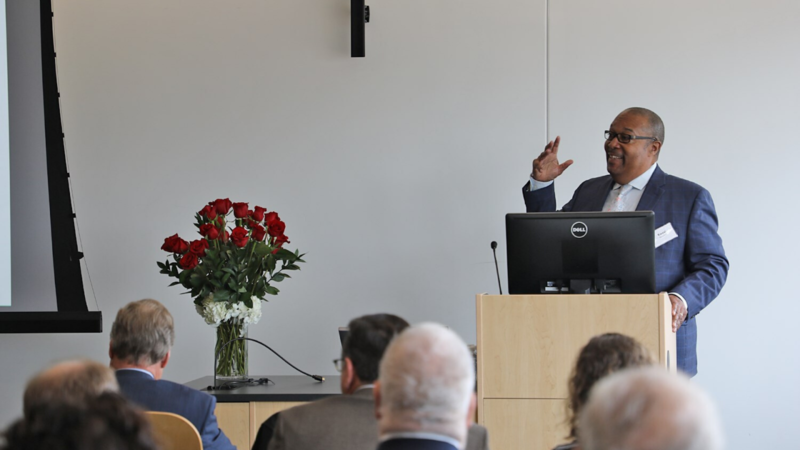 Dr. Brookins talking at a podium