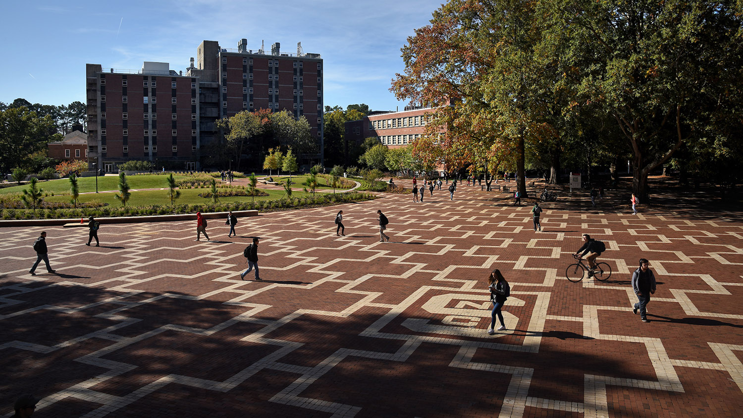 students walking to class on brickyard