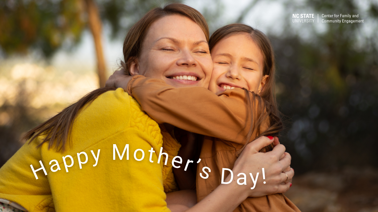 Mother and daughter smile and hug